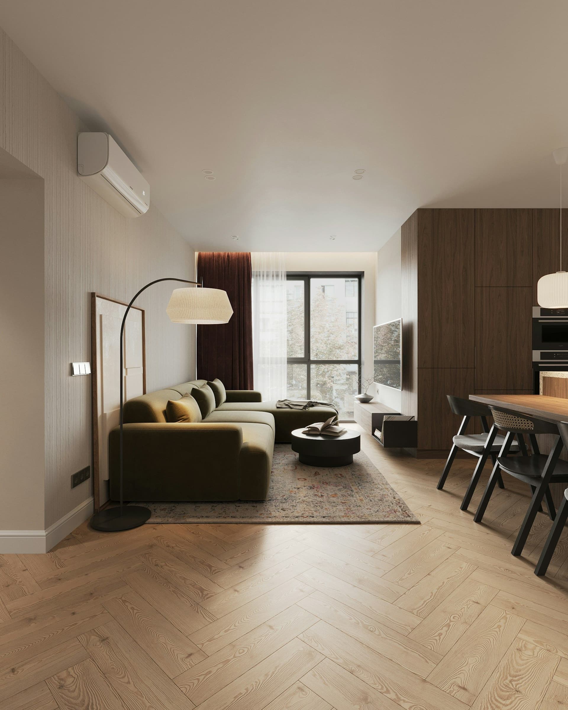 Finished living room with a green sofa, a herringbone wood floor, a wall-mounted air conditioner and a dining table beyond